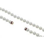 ALISSA - Here is a classic piece, enriched with a crystal rodhium studded magnet closing!
Jewel made of white pearl with crystal closing and ruby carr&egrave; stones. - A.Z. Bigiotterie