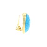 BARBARA - An oval shaped earring with thin metal border, a charge of light on your face!
Jewel made of light gold and turquoise resin. - A.Z. Bigiotterie