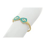 Light gold and white crystals with acquamarina central on turquoise enamel