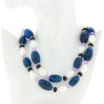 GRACE - GRACE &egrave; il perfetto binomio di eleganza e raffinatezza che pu&ograve; essere indossato per una serata speciale.
&Egrave; un accessorio realizzato con rodio, resina azzurro scuro alternato con perla, resina nera e perlina viola. - A.Z. Bigiotterie